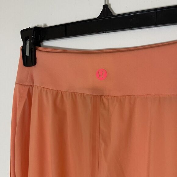 LULULEMON orange peach lightweight magnetic slit hem jogger pants 4 - Picture 2 of 8